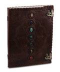 Dark brown journal with seven colored stones and two metal clasps, upright cover view.